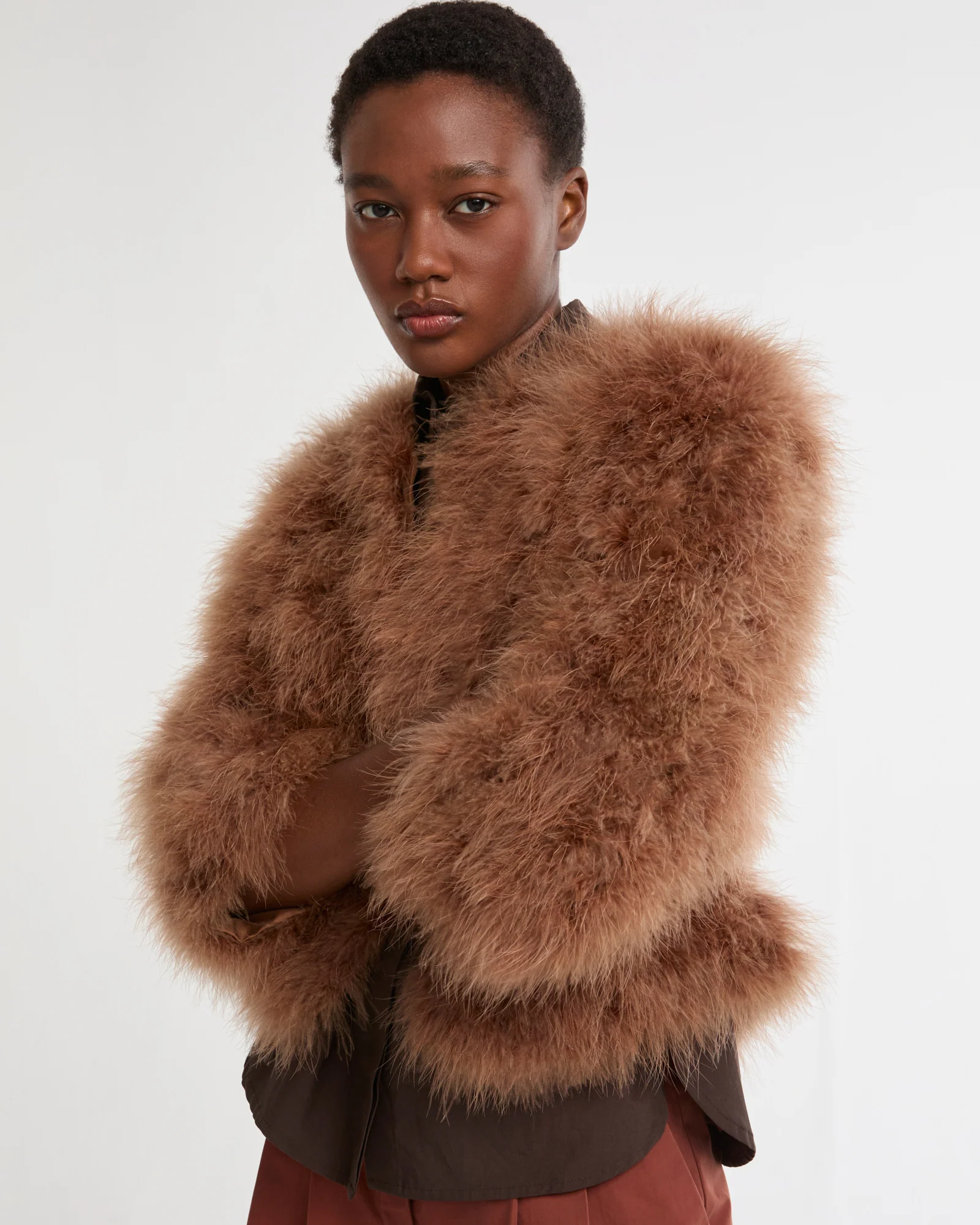 Veste courte en plumes